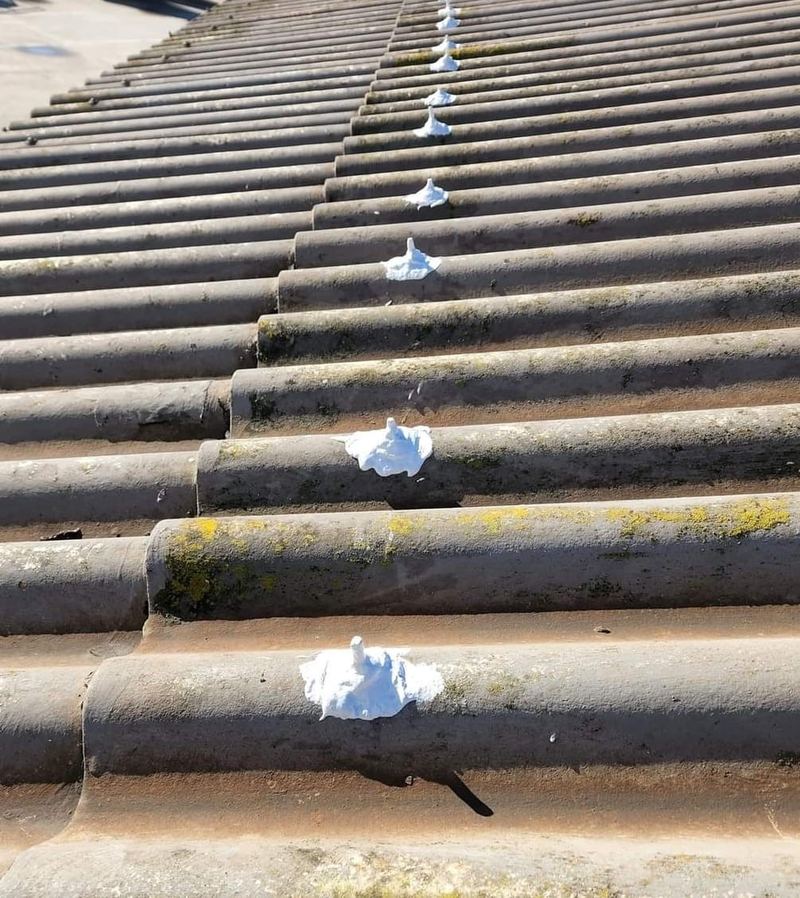 Roof repair with sealant on tile roof