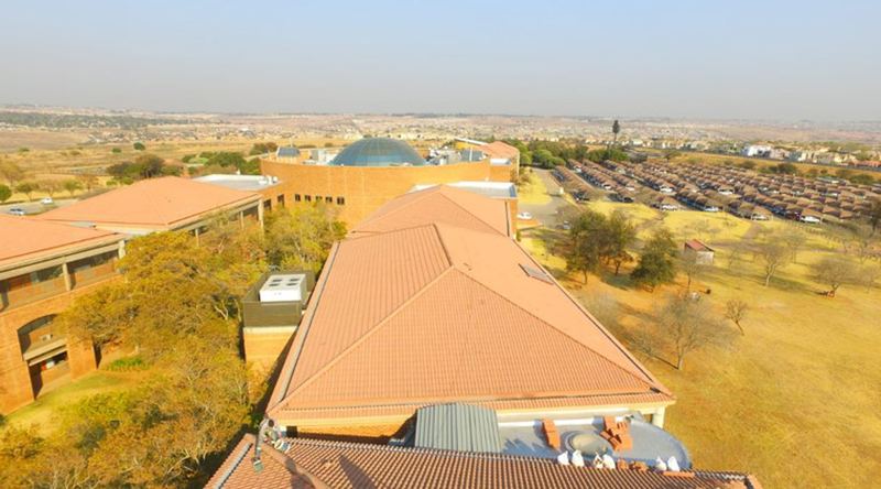 Aerial view of a large tile roof restoration project